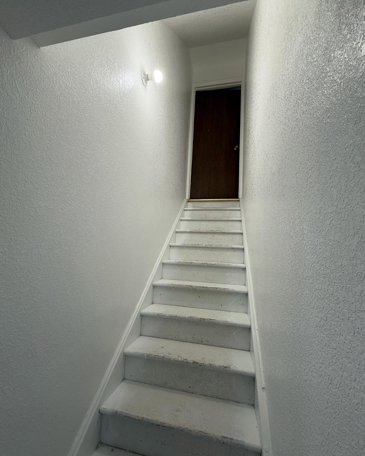 Basement transformation with drywall and paint by Mountain Ridge Renovations
