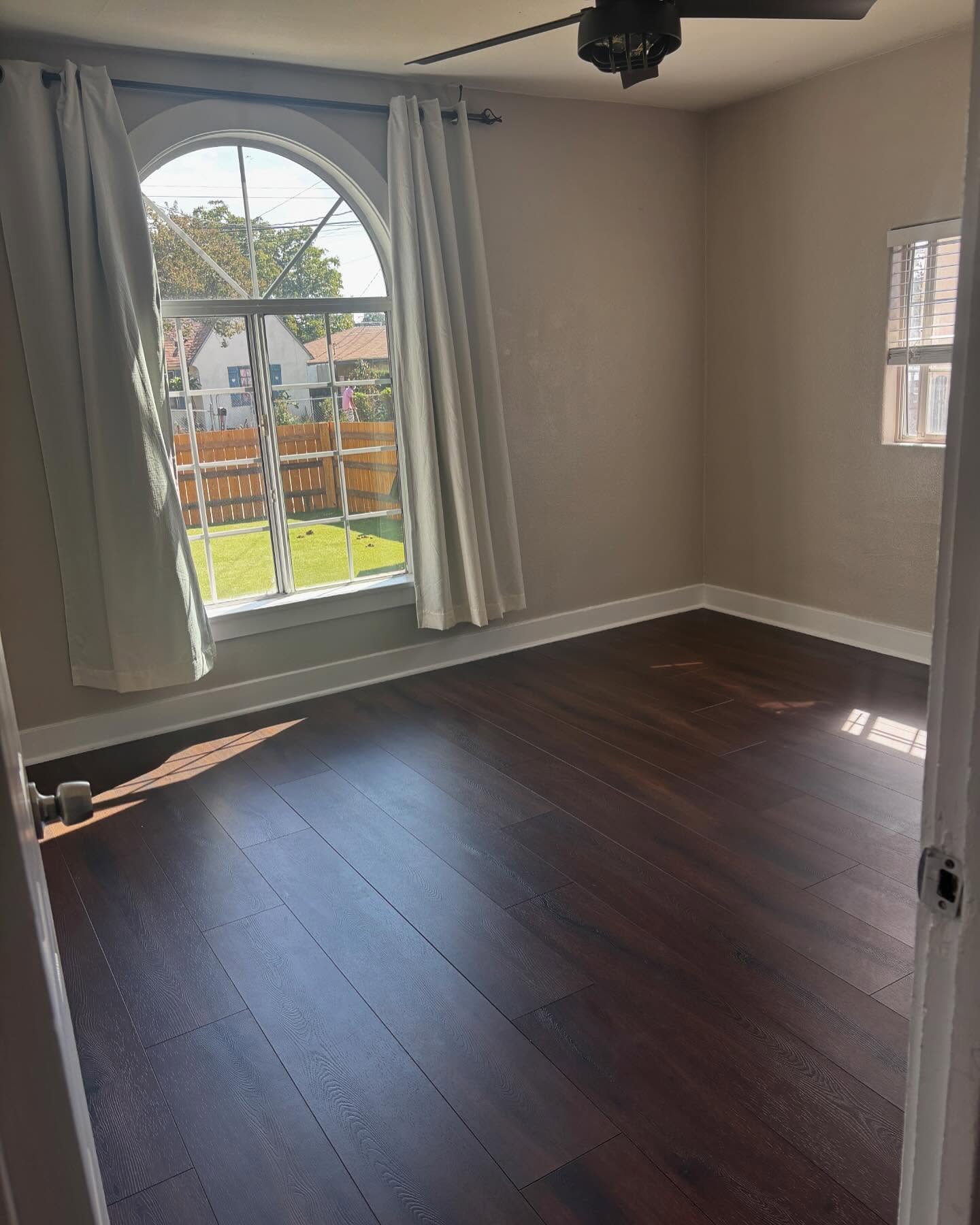 Finished laminate wood flooring installation by Mountain Ridge Renovations LLC