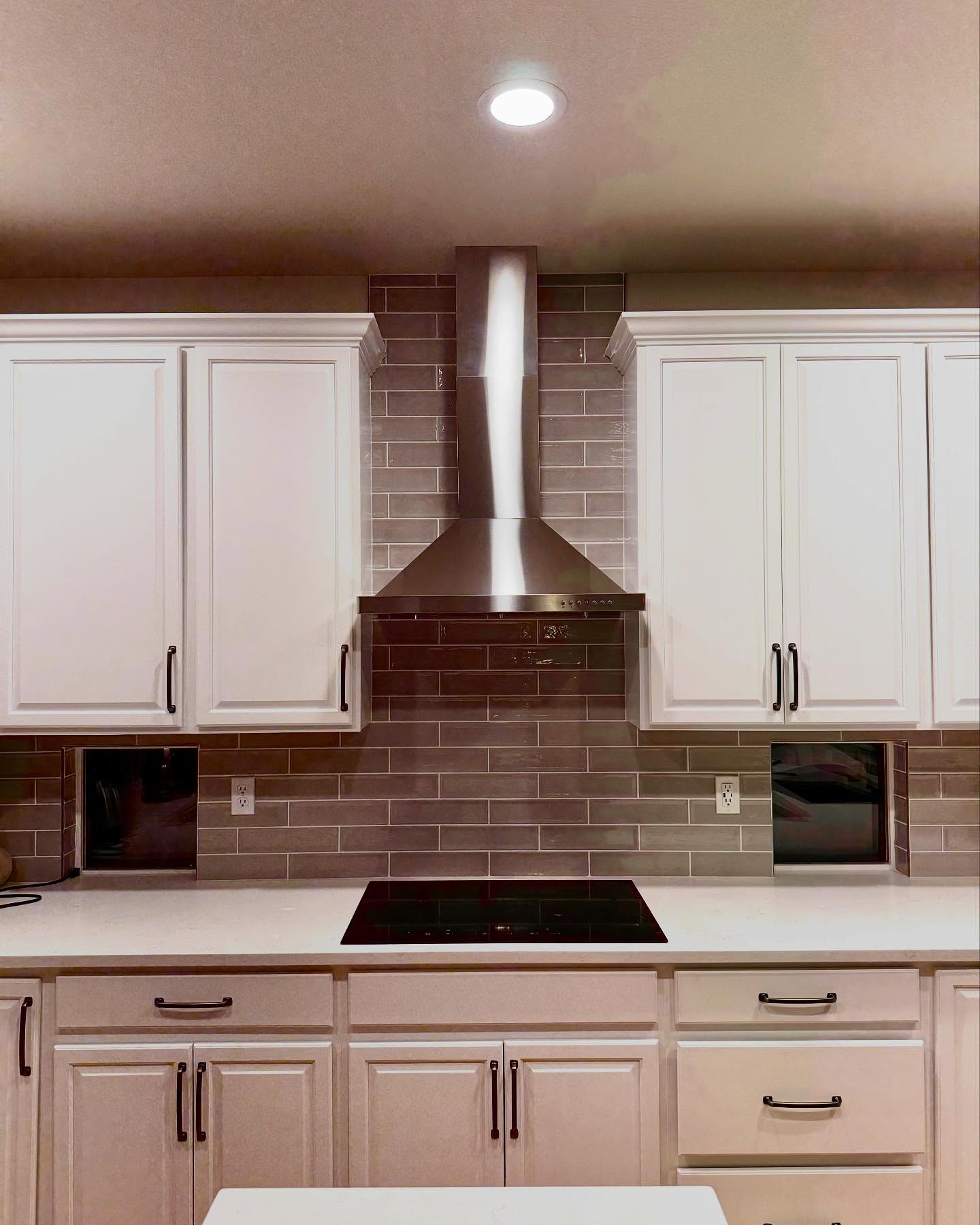 Kitchen range installation and backsplash work by Mountain Ridge Renovations LLC