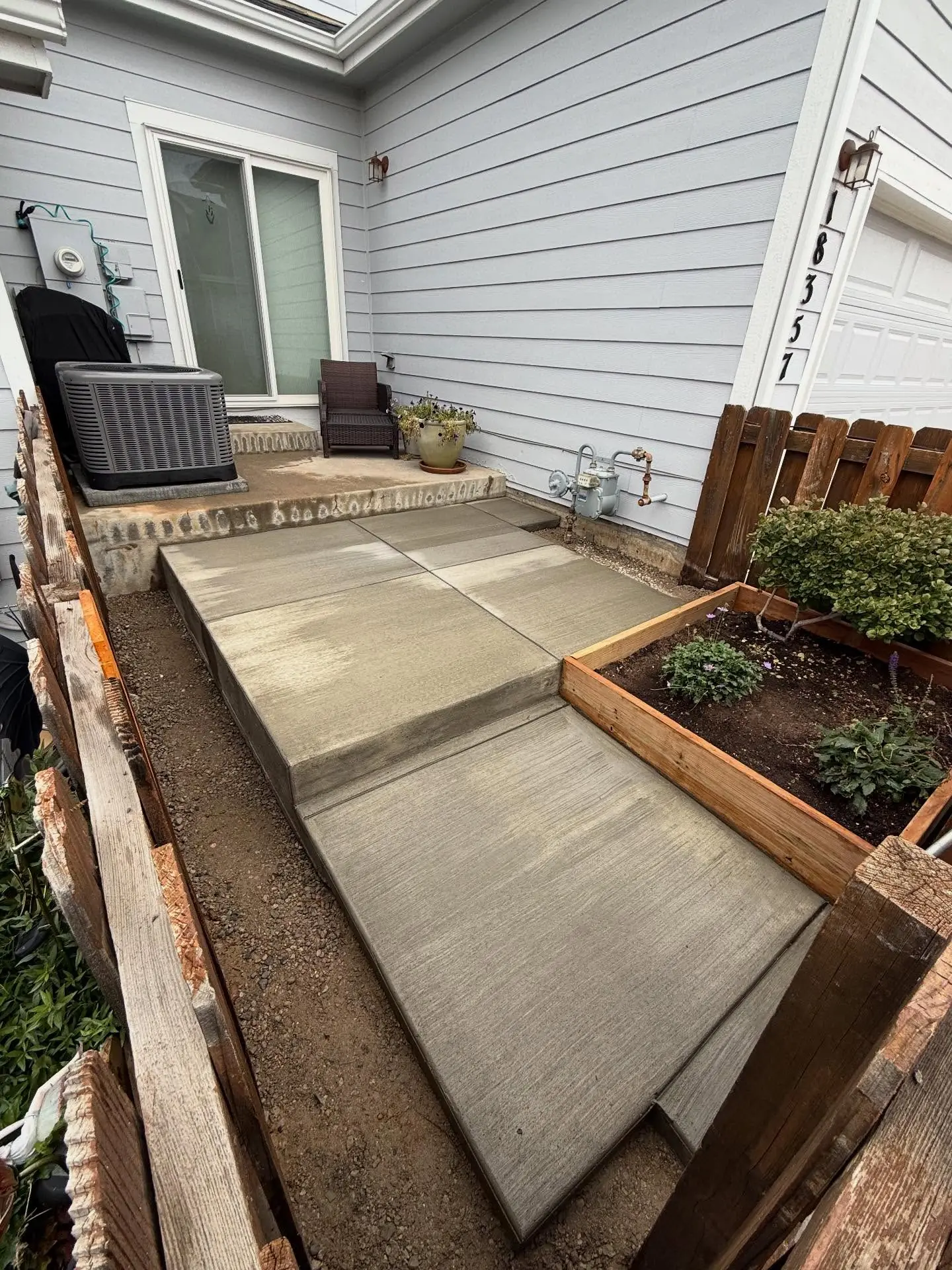 Updated concrete patio with steps – concrete construction by Mountain Ridge Renovations in Denver, Colorado